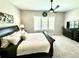 Comfortable main bedroom featuring a ceiling fan and large dresser with TV at 5668 Shadescale Way, Castle Rock, CO 80104