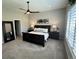 Spacious main bedroom features ceiling fan, with closet and large windows at 5668 Shadescale Way, Castle Rock, CO 80104
