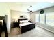 Cozy main bedroom featuring a ceiling fan, plush carpet, and ample natural light at 5668 Shadescale Way, Castle Rock, CO 80104