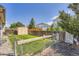 Lush backyard with green grass and privacy fencing, perfect for pets at 4548 Gibraltar Way, Denver, CO 80249