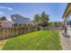 Spacious backyard with green grass and privacy fencing, ideal for outdoor activities at 4548 Gibraltar Way, Denver, CO 80249