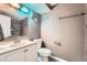 Bathroom with modern vanity, updated fixtures, and combined tub-shower with tile surround at 4548 Gibraltar Way, Denver, CO 80249