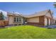 Charming single-Gathering home featuring a well-manicured lawn and an attached two-car garage at 4548 Gibraltar Way, Denver, CO 80249