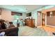 Spacious living room featuring a large dresser and ample natural light at 4548 Gibraltar Way, Denver, CO 80249