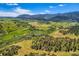 Expansive aerial shot of rolling hills and lush greenery, ideal for outdoor enthusiasts and nature lovers at 8280 Bannock Dr, Larkspur, CO 80118