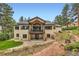 Large backyard with two levels of balconies perfect for enjoying outdoor living and entertaining at 8280 Bannock Dr, Larkspur, CO 80118
