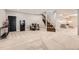 Finished basement area with carpet, stairs, seating, and unique dart board at 8280 Bannock Dr, Larkspur, CO 80118