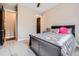 Bedroom featuring neutral walls, patterned carpet, a ceiling fan, and dark doors at 8280 Bannock Dr, Larkspur, CO 80118