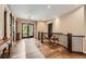 Welcoming foyer with wood floors and staircase to second level offers a grand entryway into the home at 8280 Bannock Dr, Larkspur, CO 80118