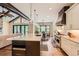Open kitchen with vaulted ceilings, stainless steel appliances, and quartz countertops at 8280 Bannock Dr, Larkspur, CO 80118