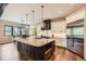Gorgeous kitchen featuring a large island, stainless steel appliances, and pendant lighting at 8280 Bannock Dr, Larkspur, CO 80118
