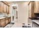Spacious laundry room with plenty of cabinets and counter space at 8280 Bannock Dr, Larkspur, CO 80118