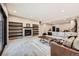Spacious living room featuring built in shelving, stone fireplace and carpet at 8280 Bannock Dr, Larkspur, CO 80118