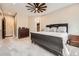 Spacious main bedroom featuring a decorative ceiling fan and access to ensuite bathroom and walk-in closet at 8280 Bannock Dr, Larkspur, CO 80118