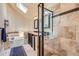 Luxurious bathroom featuring a glass shower, tub and plenty of natural light at 7445 Shoreham Pl, Castle Pines, CO 80108