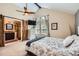 Serene bedroom with vaulted ceilings, ceiling fan, and barn door to the bathroom at 7445 Shoreham Pl, Castle Pines, CO 80108