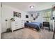 Bright bedroom with a comfortable bed, desk, and plenty of storage at 7445 Shoreham Pl, Castle Pines, CO 80108