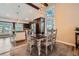 Bright dining area adjacent to kitchen with a stylish pendant lighting fixture at 7445 Shoreham Pl, Castle Pines, CO 80108
