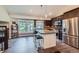 Well-equipped kitchen with granite counters, stainless appliances, and an island with stool seating at 7445 Shoreham Pl, Castle Pines, CO 80108