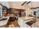 Modern kitchen with granite counters, stainless appliances, a center island and ample cabinet space at 7445 Shoreham Pl, Castle Pines, CO 80108