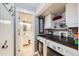 Convenient laundry room with washer, dryer, and adjacent half bathroom at 7445 Shoreham Pl, Castle Pines, CO 80108