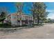 Charming apartment building with a well-maintained exterior and mature trees in a serene neighborhood setting at 8745 Yukon St # 30, Arvada, CO 80005