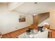Comfortable living room with hardwood floors, a staircase, and an open layout with easy access to other rooms at 8745 Yukon St # 30, Arvada, CO 80005