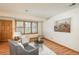 Cozy living room featuring hardwood floors, updated windows, and plenty of space for relaxing and entertaining guests at 8745 Yukon St # 30, Arvada, CO 80005