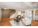 Comfortable living room with hardwood floors, a staircase, and an open layout with plenty of natural light at 8745 Yukon St # 30, Arvada, CO 80005