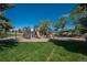 A fun-filled playground area with slides and climbing structures for children in a community park at 8745 Yukon St # 30, Arvada, CO 80005