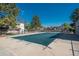 The community pool, covered for the off-season, offers a relaxing amenity for residents, surrounded by trees at 8745 Yukon St # 30, Arvada, CO 80005