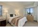 Inviting bedroom featuring cozy decor and ample natural light from the windows at 6380 S Boston St # 111, Greenwood Village, CO 80111