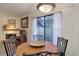 Cozy dining area with sliding door access to patio at 6380 S Boston St # 111, Greenwood Village, CO 80111