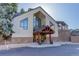 Front exterior featuring peaked entryway and architectural details at 6380 S Boston St # 111, Greenwood Village, CO 80111