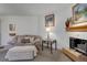 Comfortable living room features a cozy fireplace at 6380 S Boston St # 111, Greenwood Village, CO 80111