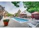 Inviting community pool with lounge chairs, umbrellas, and beautiful landscaping, perfect for relaxing and entertaining at 6380 S Boston St # 111, Greenwood Village, CO 80111