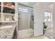 Bathroom featuring a glass-enclosed shower, modern vanity, and neutral color palette at 10117 Morrison Rd, Lakewood, CO 80227