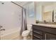 Full bathroom with a combined shower and bathtub, and modern vanity at 10117 Morrison Rd, Lakewood, CO 80227