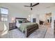 Spacious bedroom showcasing a comfortable bed, neutral tones, and ample natural light at 10117 Morrison Rd, Lakewood, CO 80227