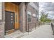 Inviting entryway with a stylish front door, brick accents, and a ramp for accessibility, creating a warm welcome at 10117 Morrison Rd, Lakewood, CO 80227