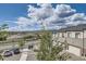 Well-maintained townhomes with private garages, landscaping, and convenient street parking in a suburban setting at 10117 Morrison Rd, Lakewood, CO 80227