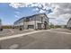 Modern townhome featuring a two-car garage and contemporary architectural details in a well-maintained community at 10117 Morrison Rd, Lakewood, CO 80227