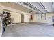 Spacious garage with ample room for parking and storage, featuring a bright interior and clean concrete floors at 10117 Morrison Rd, Lakewood, CO 80227