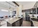 Modern kitchen with granite countertops, stainless steel appliances, and open layout to the living area at 10117 Morrison Rd, Lakewood, CO 80227