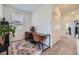 Bright home office featuring neutral walls, modern desk, and a large window offering ample natural light at 10117 Morrison Rd, Lakewood, CO 80227