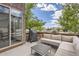 Relaxing outdoor patio featuring comfortable seating, a grill, and views of the landscaped surroundings at 10117 Morrison Rd, Lakewood, CO 80227