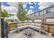 Cozy outdoor patio with comfortable seating, a built-in grill, and a scenic view of the neighborhood at 10117 Morrison Rd, Lakewood, CO 80227