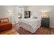 Bright bedroom with natural light, hardwood floors, large window, and comfortable furnishings at 10105 Grove Loop # D, Westminster, CO 80031