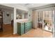 Bright dining area with wooden floors, built in cabinet and sliding doors to outdoor patio at 10105 Grove Loop # D, Westminster, CO 80031