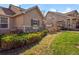 Charming home exterior featuring lush landscaping, stone accents, and a well-manicured lawn at 10105 Grove Loop # D, Westminster, CO 80031